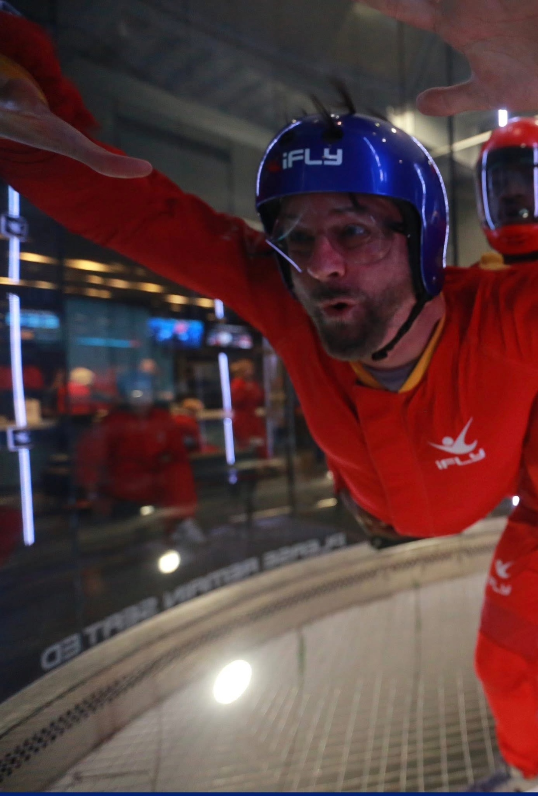 Ray Myers belly-flying in an iFLY indoor skydiving wind tunnel